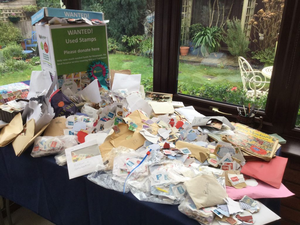 A table covered in used stamps