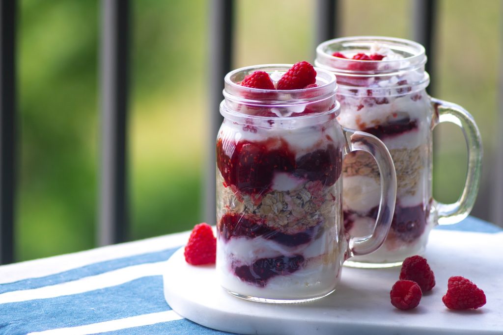 Raspberry, oats and cream in Kilner jar jugs