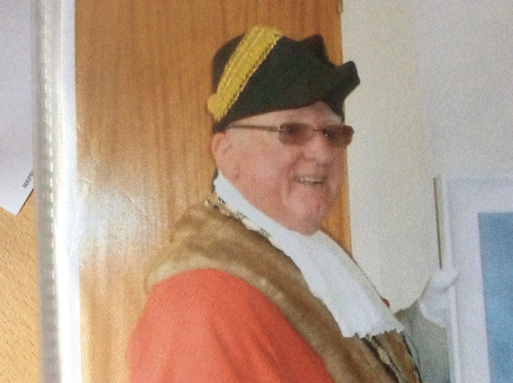 A man wearing a town crier outfit