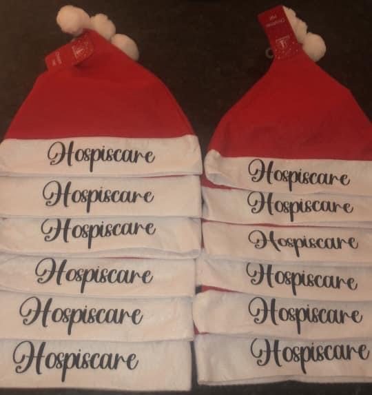 Santa hats with Hospiscare written on the brim