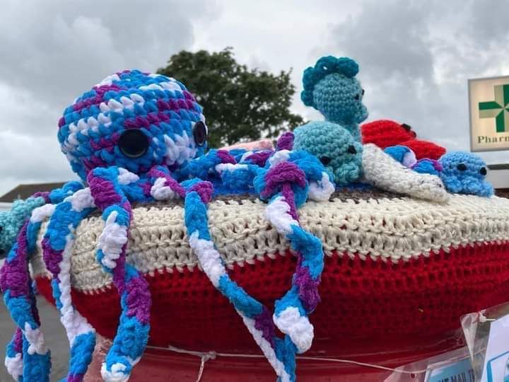 Crocheted mail box topper with an octopus