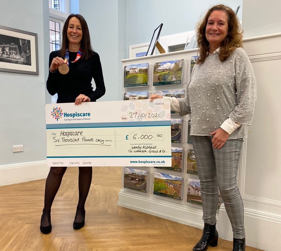 Two women holding a big cheque for Hospiscare