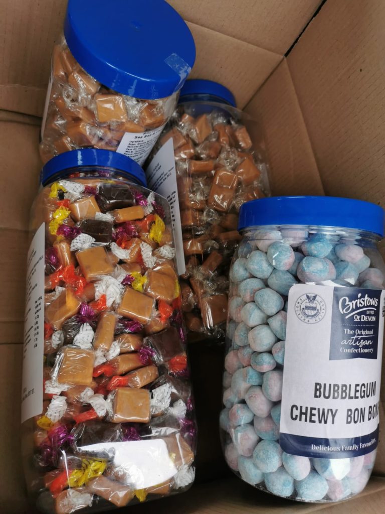 Jars of sweets in a cardboard box