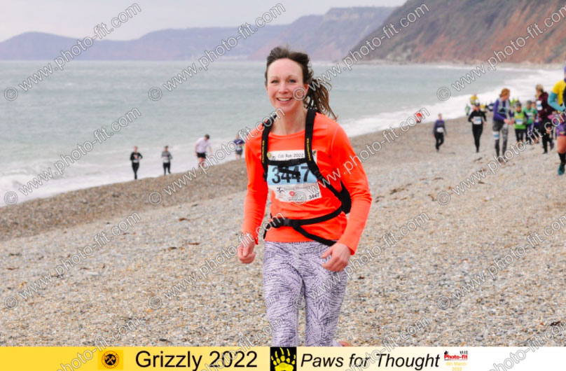 A woman running along a beach