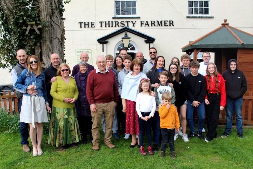 A group of people outside the Thirsty Farmer pub