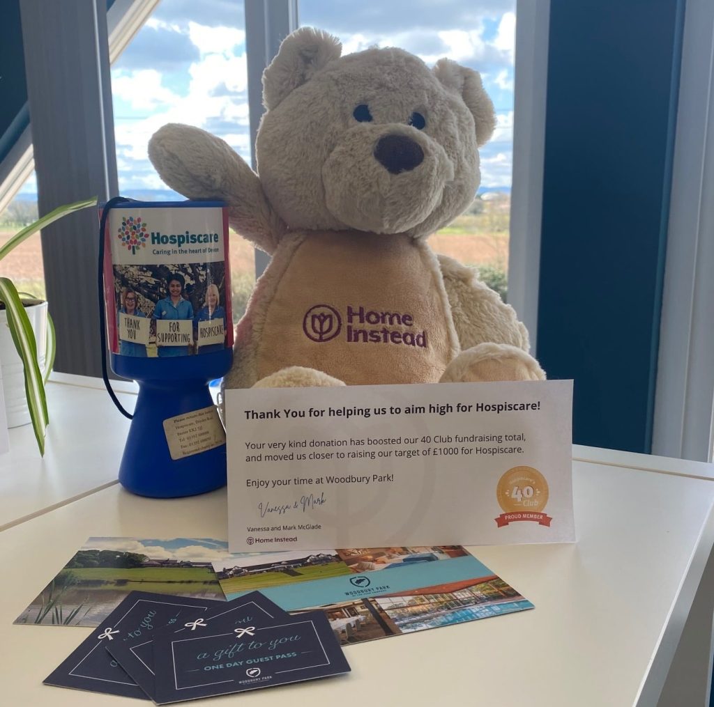 A teddy bear and Hospiscare fundraising tin