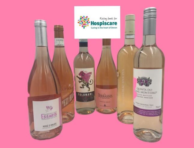 A selection of rose wines against a pink background
