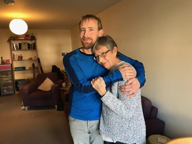 A man hugging his mum