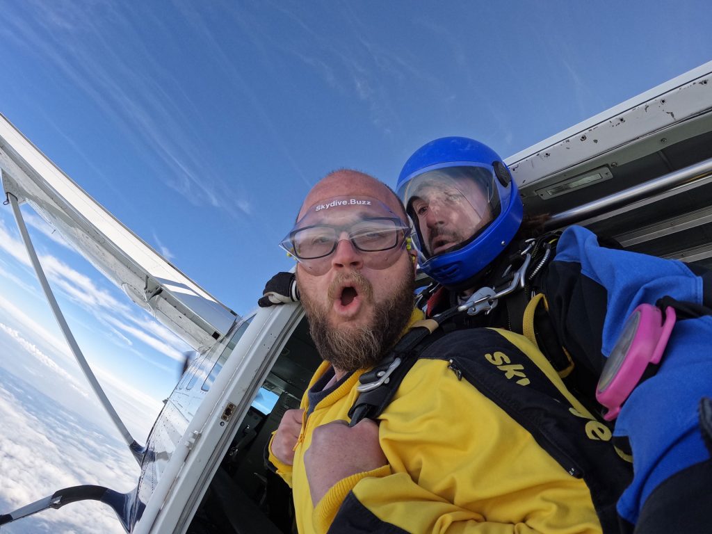 Two men jumping tandem from a plane