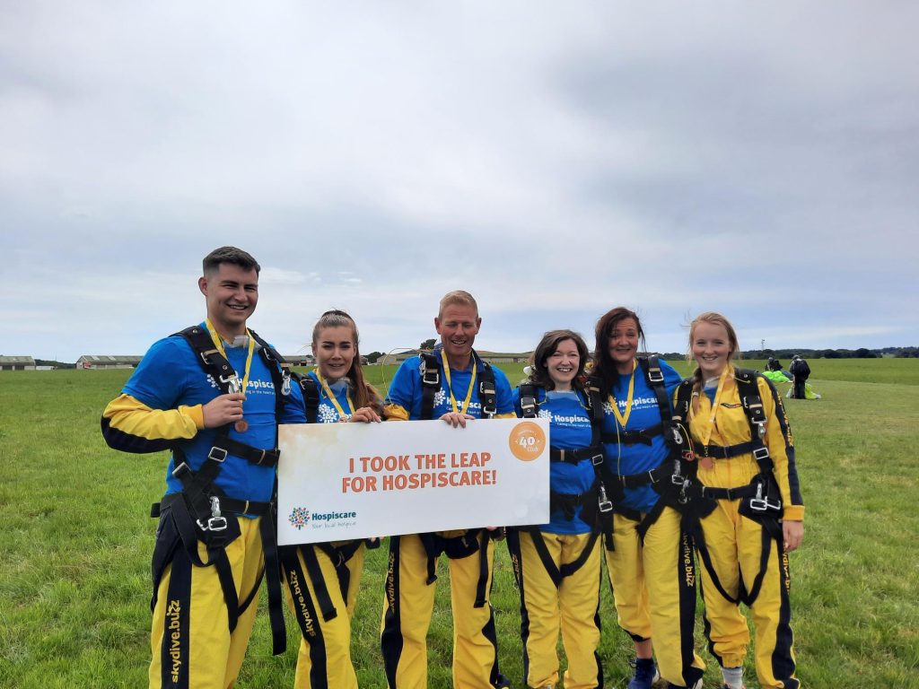 A group of people in skydive jump suits