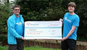Steve Pearcy presenting a cheque for £6k with Hospiscare Events Fundraiser, Martin Stokke
