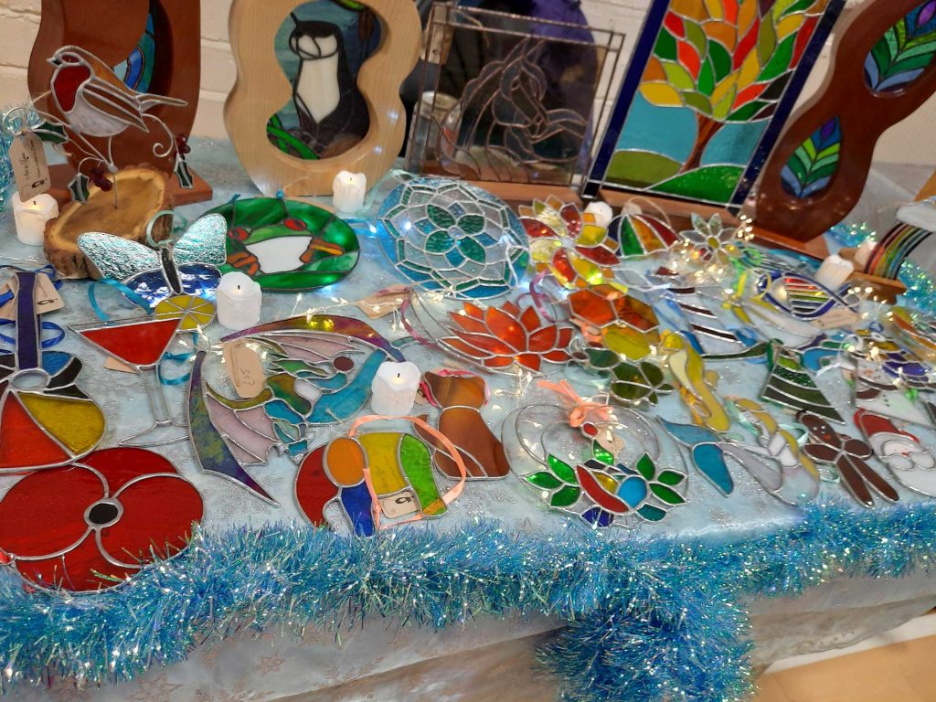 A table of stained glass ornaments